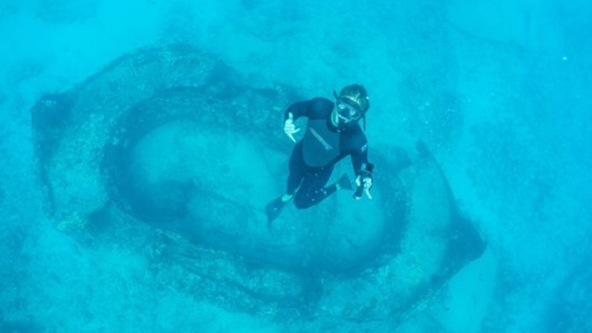 a man riding a wave on a surfboard in the water