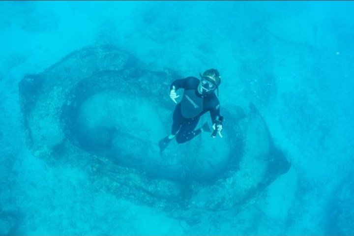 a man riding a wave on a surfboard in the water