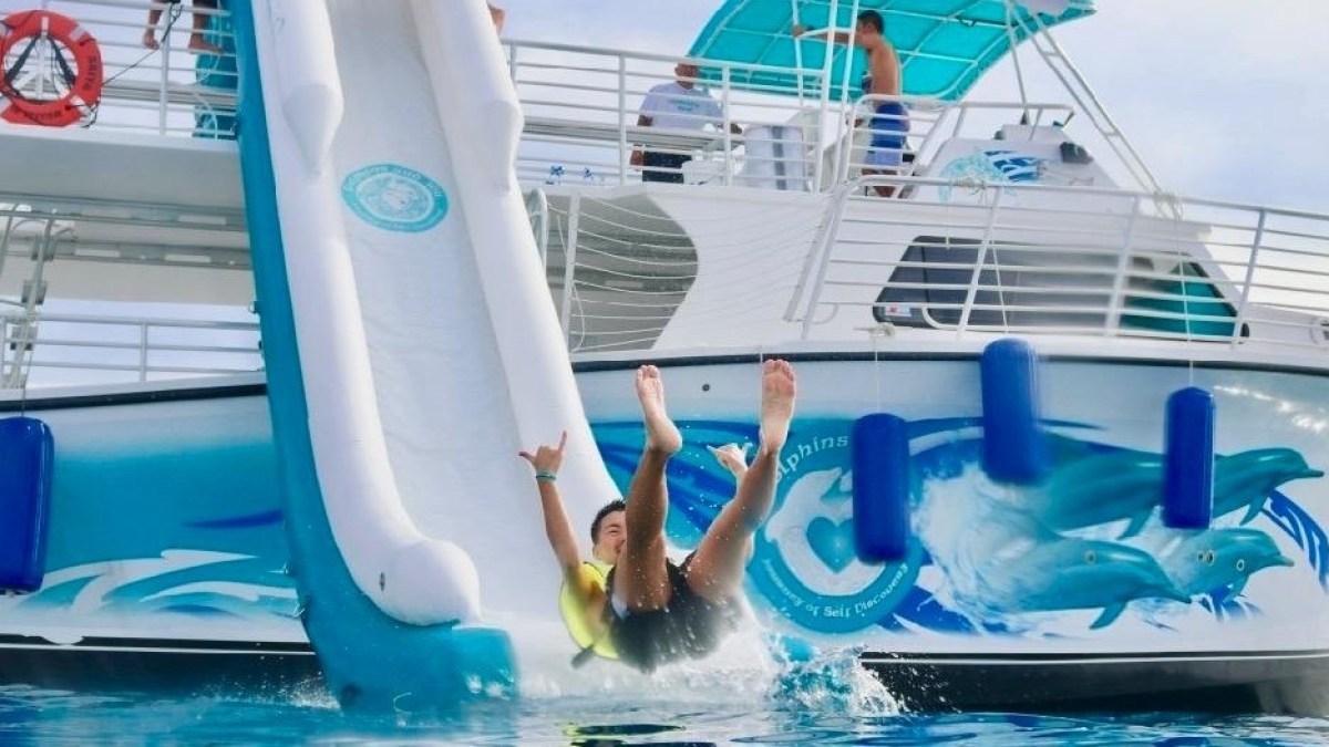 a person riding on the back of a boat