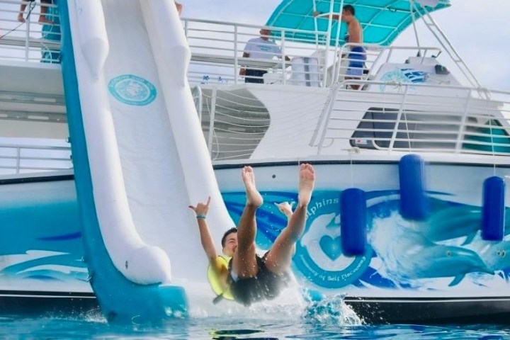a person riding on the back of a boat
