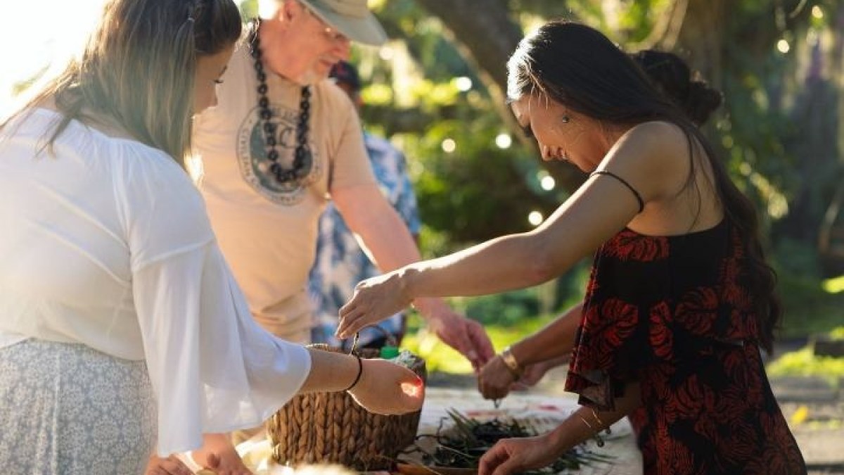 a group of people standing next to a woman