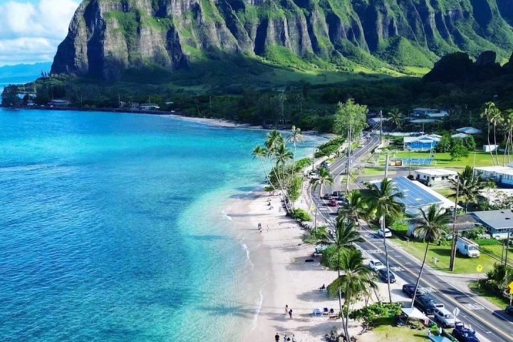 a body of water with a mountain in the background