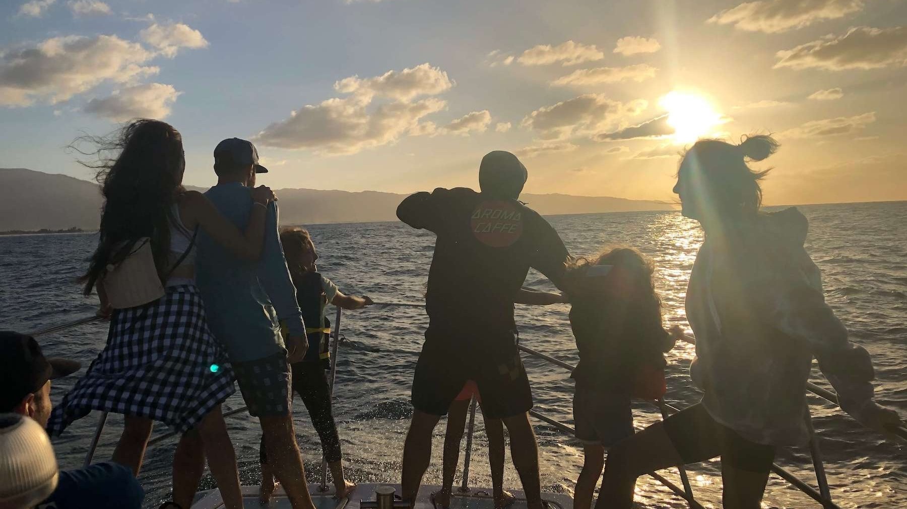 a group of people standing on a beach