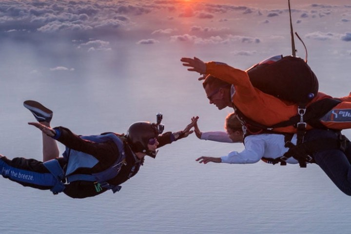 a group of people riding skis on a snowy surface