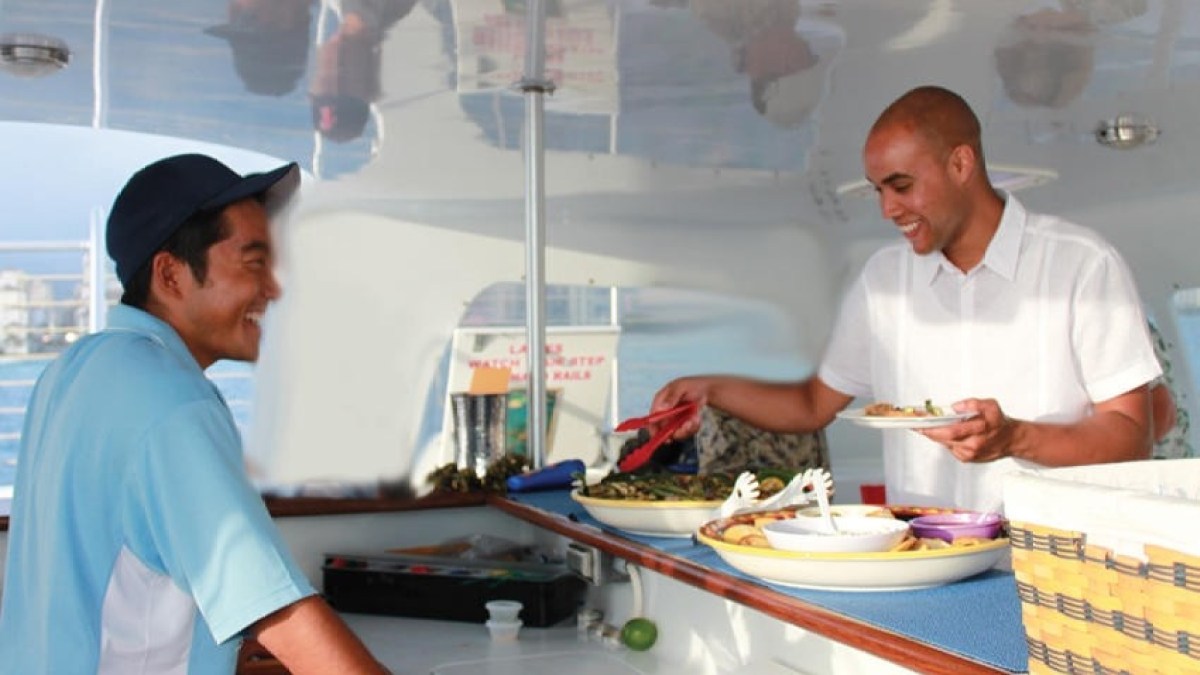 a man standing in a kitchen preparing food