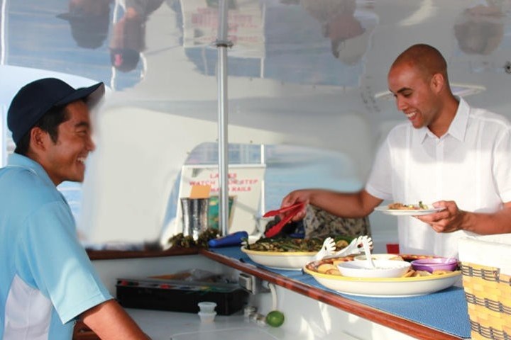 a man standing in a kitchen preparing food