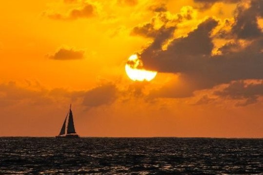 a sunset over a body of water