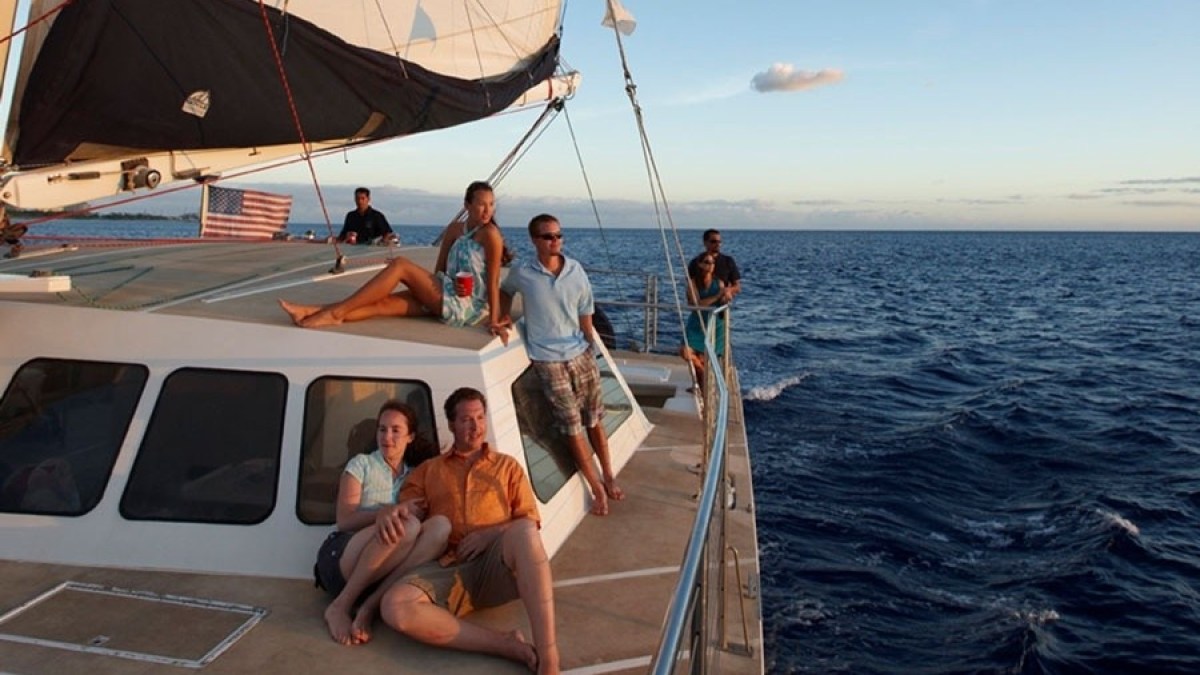 a group of people on a boat in the water