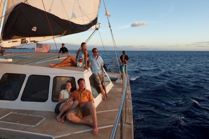 a group of people on a boat in the water