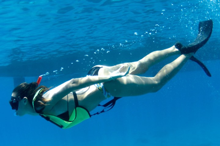 a person swimming in a pool of water