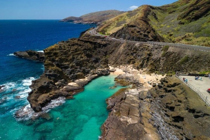 a rocky beach next to the ocean