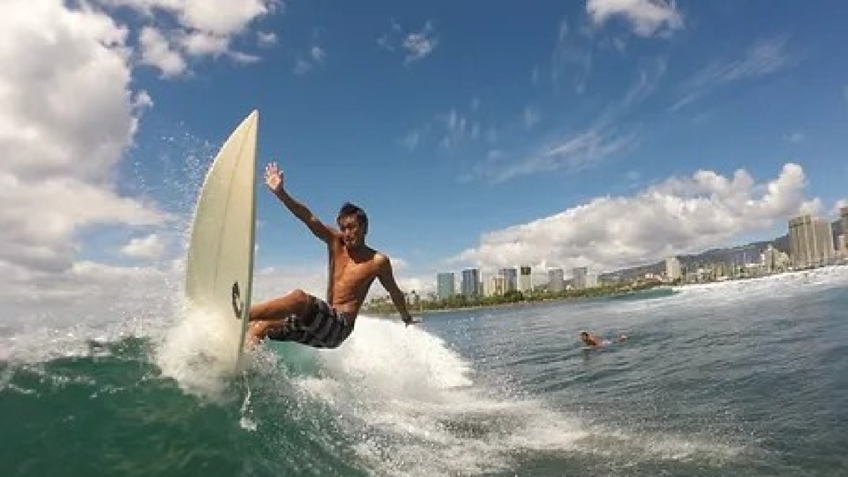 a man riding a wave on a surfboard in the ocean