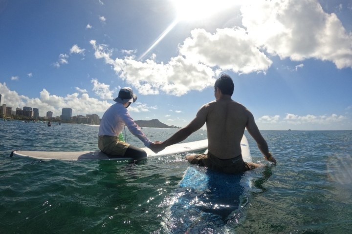 a man riding a wave on top of a body of water