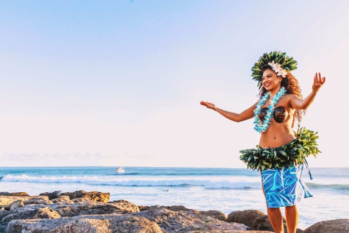 a person standing on a rocky beach