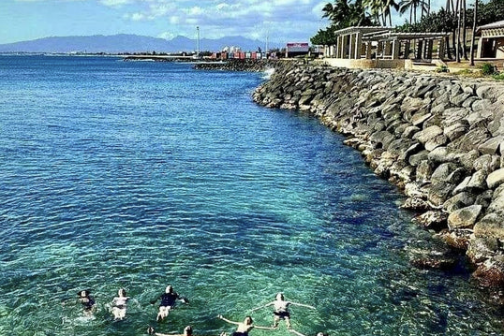 a group of people in a large body of water