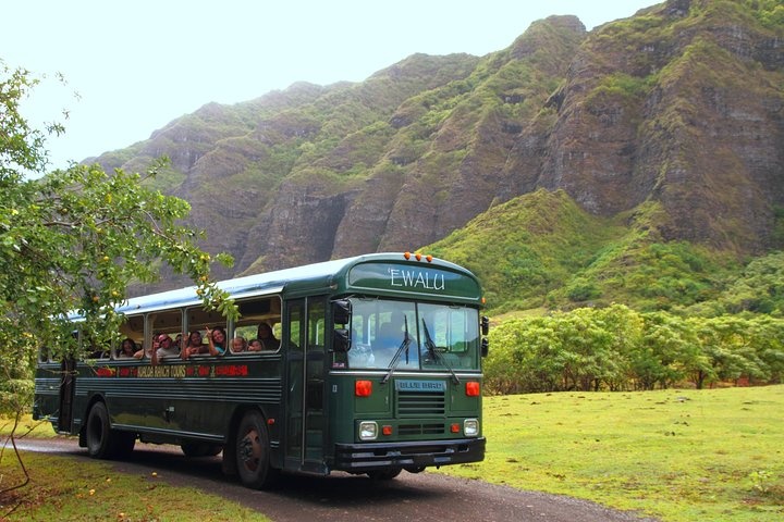 a bus driving down a mountain road