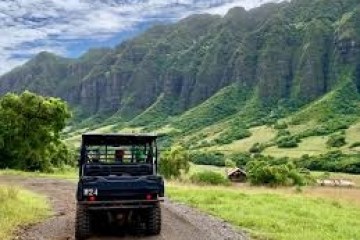 a truck driving down a dirt road