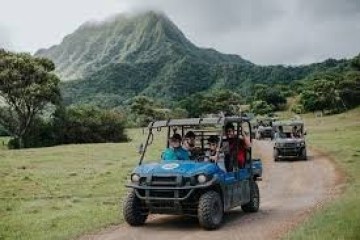a truck driving down a dirt road