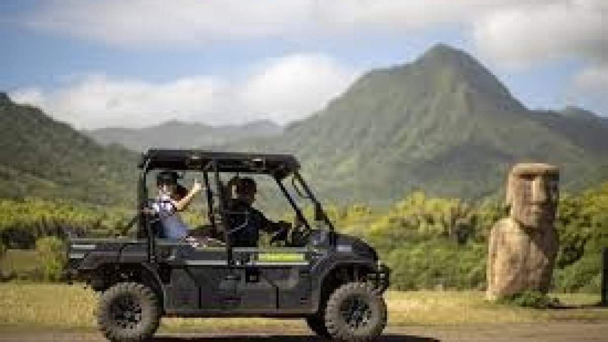 a truck driving down a dirt road
