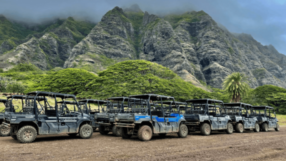 a truck driving down a dirt road