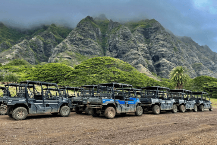 a truck driving down a dirt road