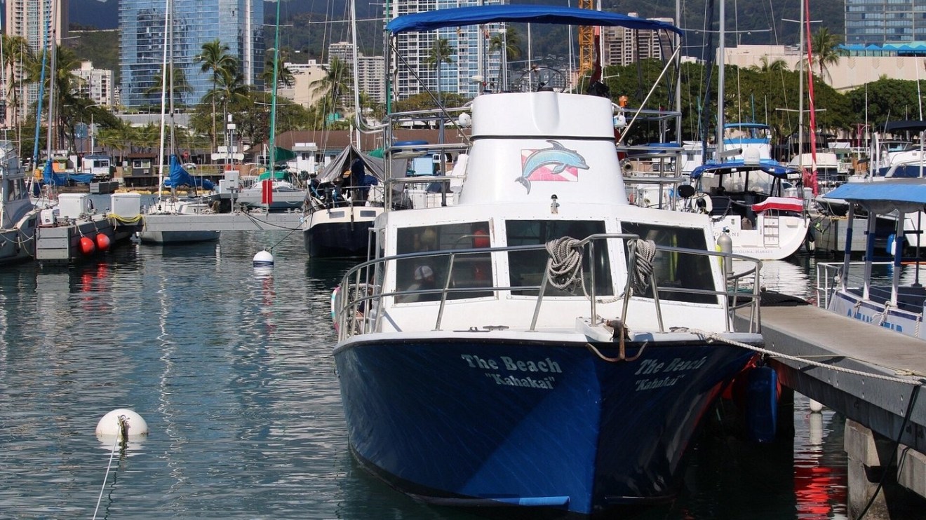 a boat is docked next to a body of water