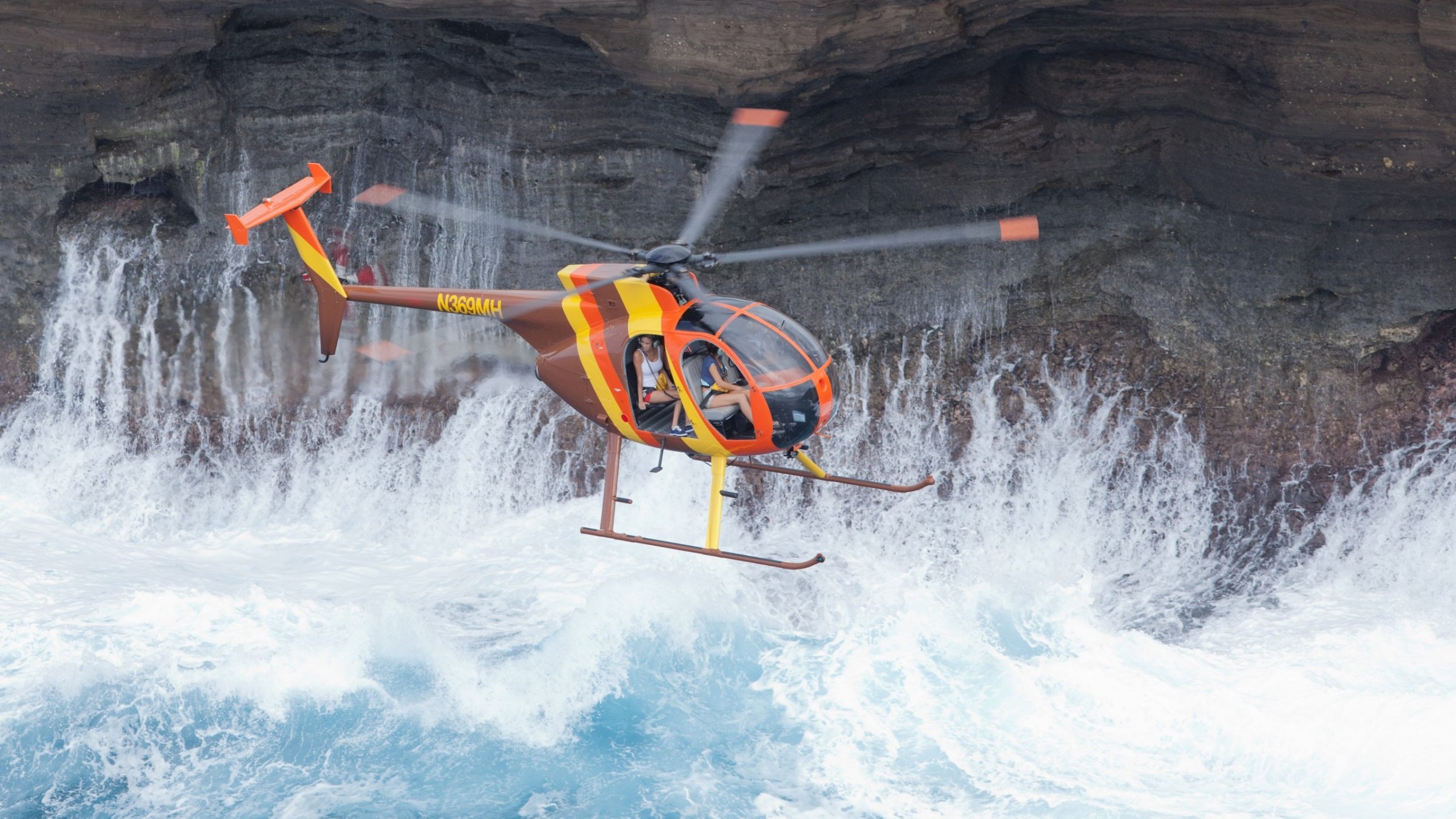 a man flying through the air while riding skis