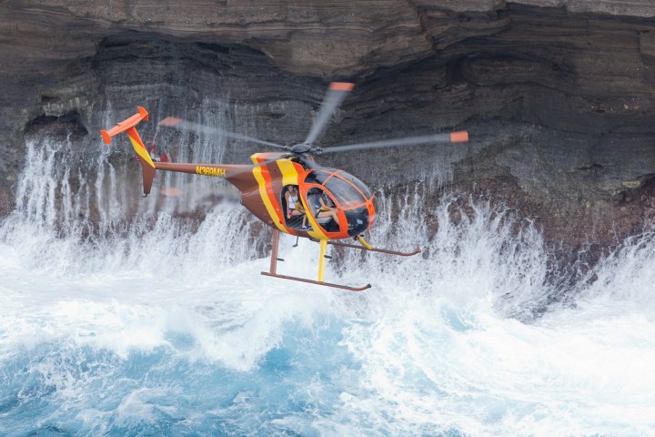 a man flying through the air while riding skis