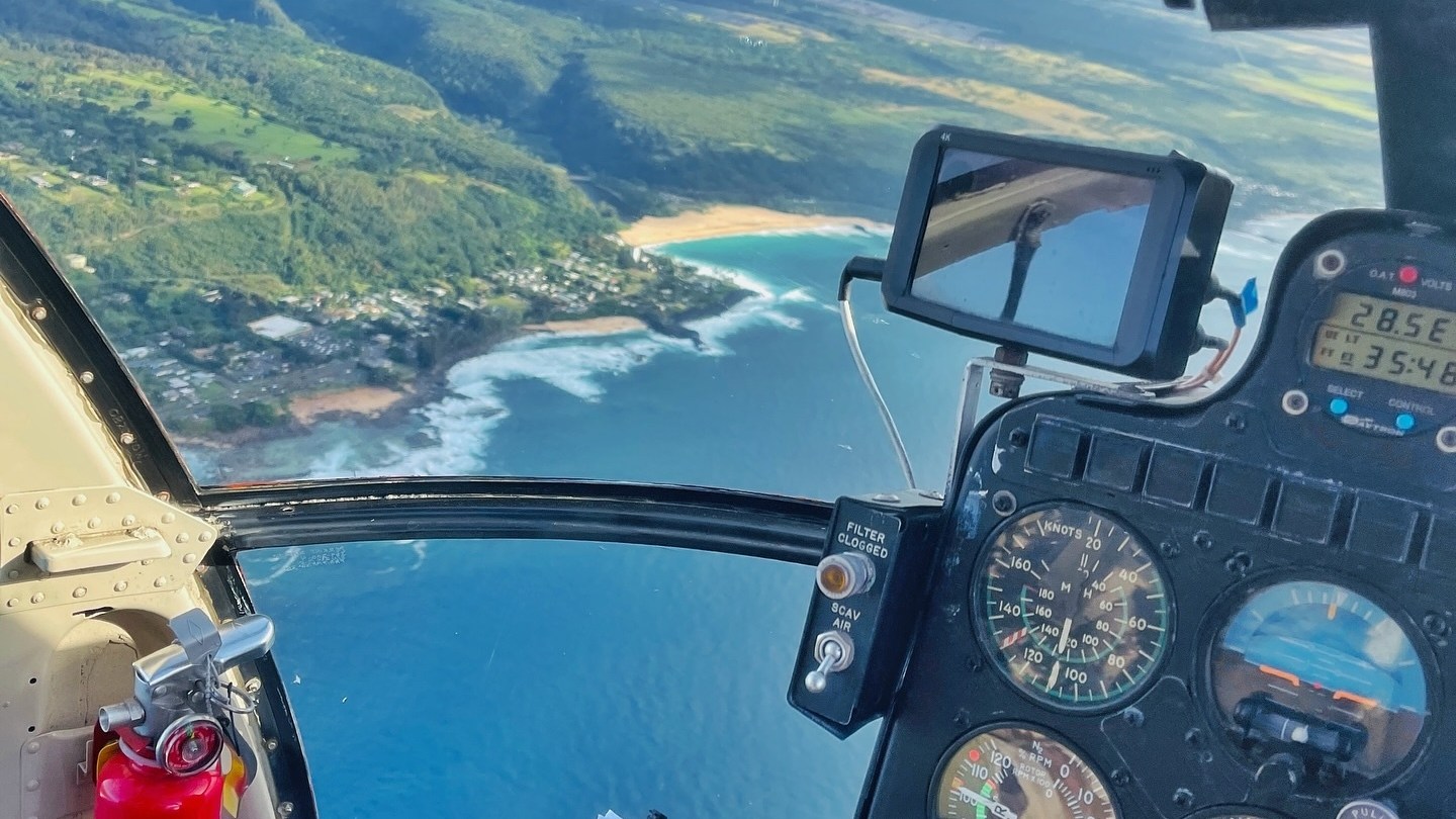 a group of people riding skis on top of a mountain