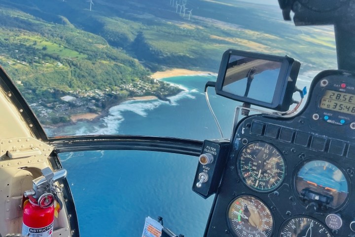 a group of people riding skis on top of a mountain