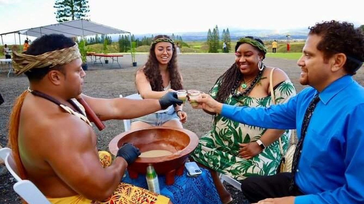a group of people sitting at a park