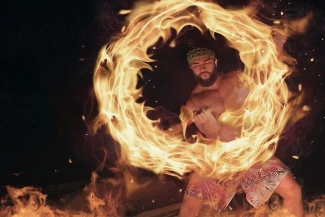 a person standing in front of a fire