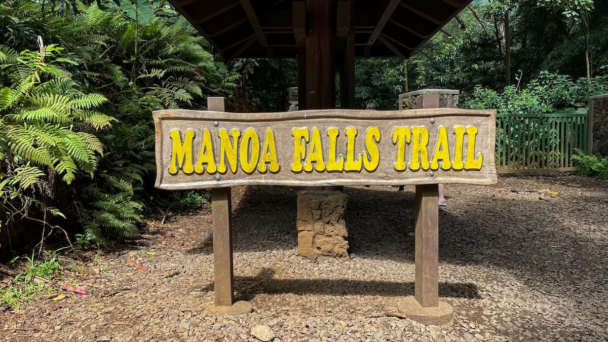 a sign on a wooden bench