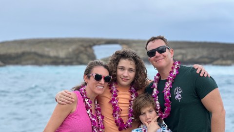 a person standing next to a body of water