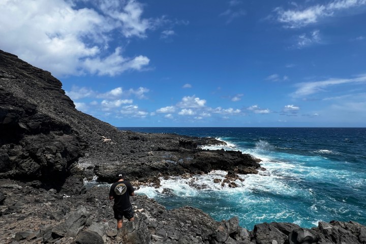 a group of people on a rocky beach