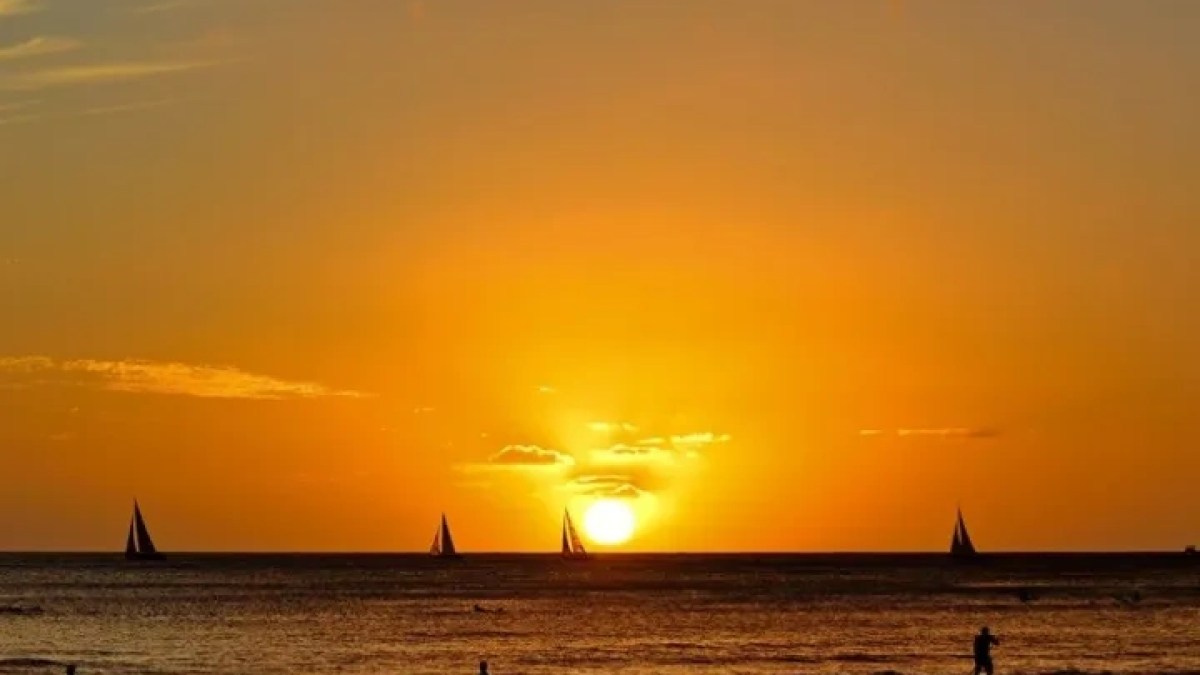 a sunset over a body of water