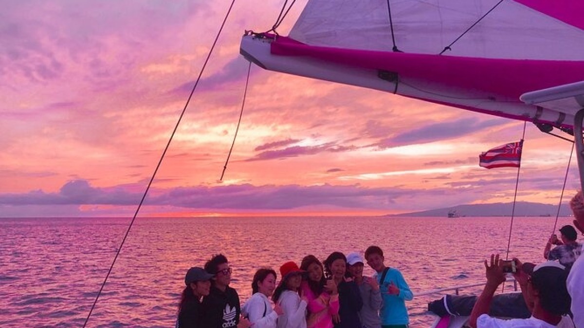 a group of people on a boat in a large body of water