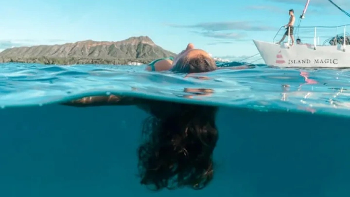 a person swimming in a pool of water
