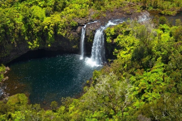 a large waterfall in a forest
