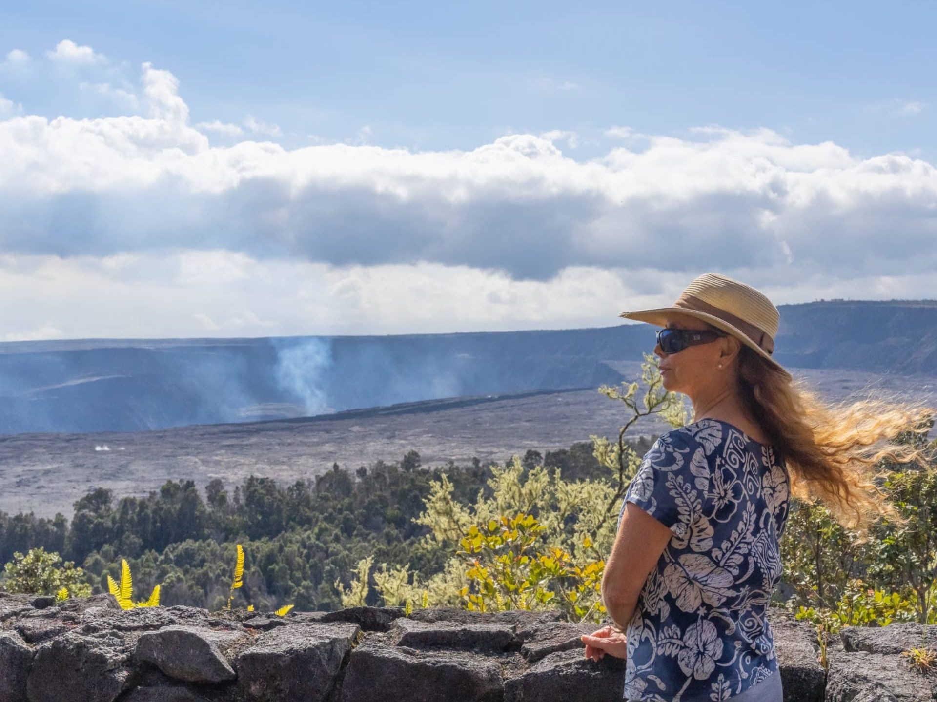 a person standing in front of a mountain