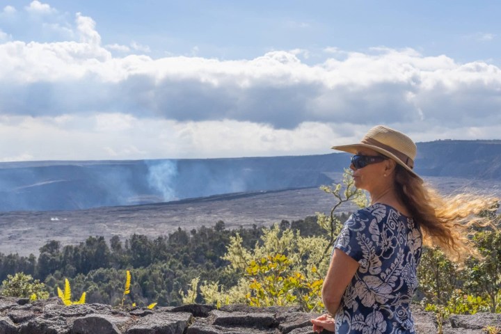 a person standing in front of a mountain