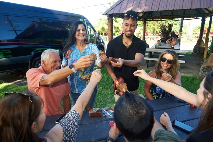 a group of people sitting at a zoo