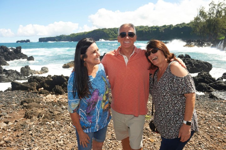 a person standing in front of a body of water