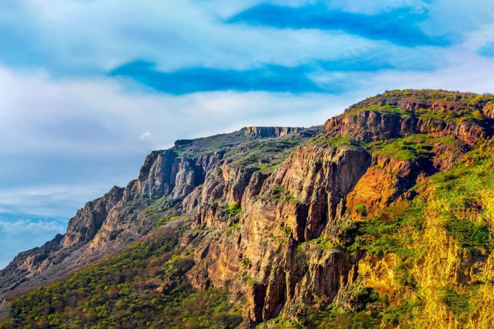 a canyon with a mountain in the background