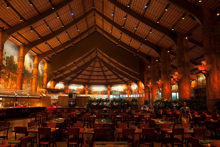a group of people sitting at a table in a restaurant