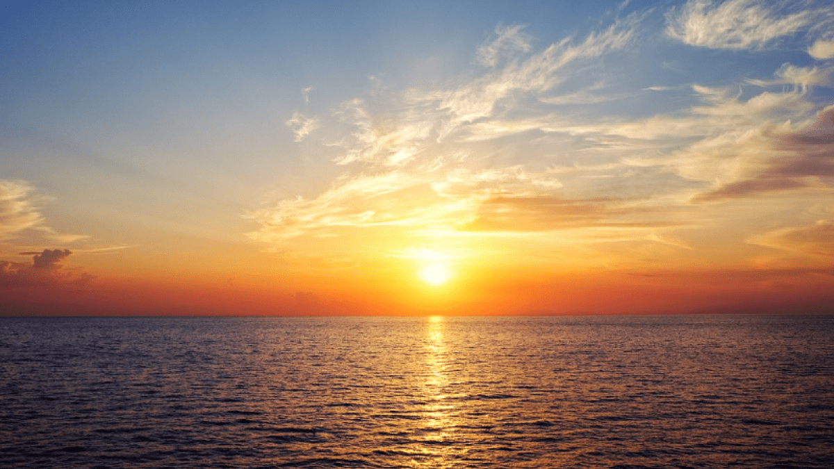 a sunset over a body of water