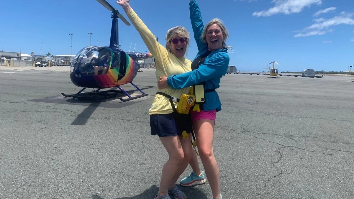 a little boy that is standing in the sand
