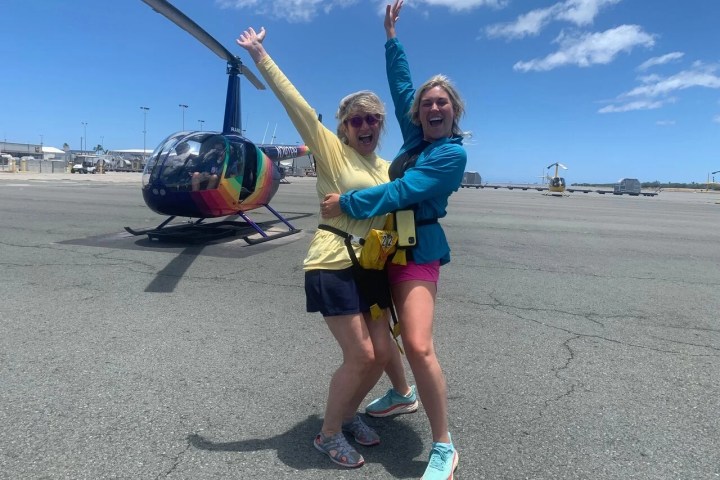 a little boy that is standing in the sand