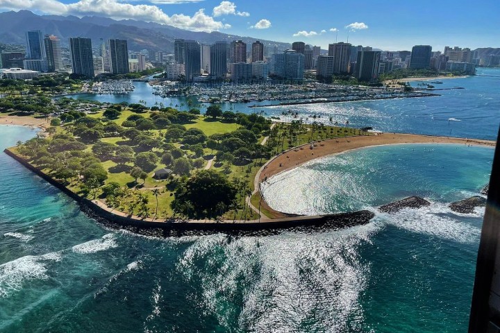 a body of water with a city in the background
