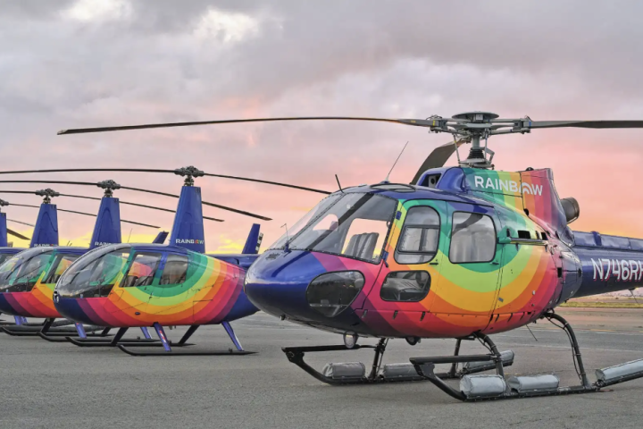 a small plane sitting on top of a helicopter